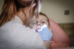 orthodontics in denton working on a patients teeth