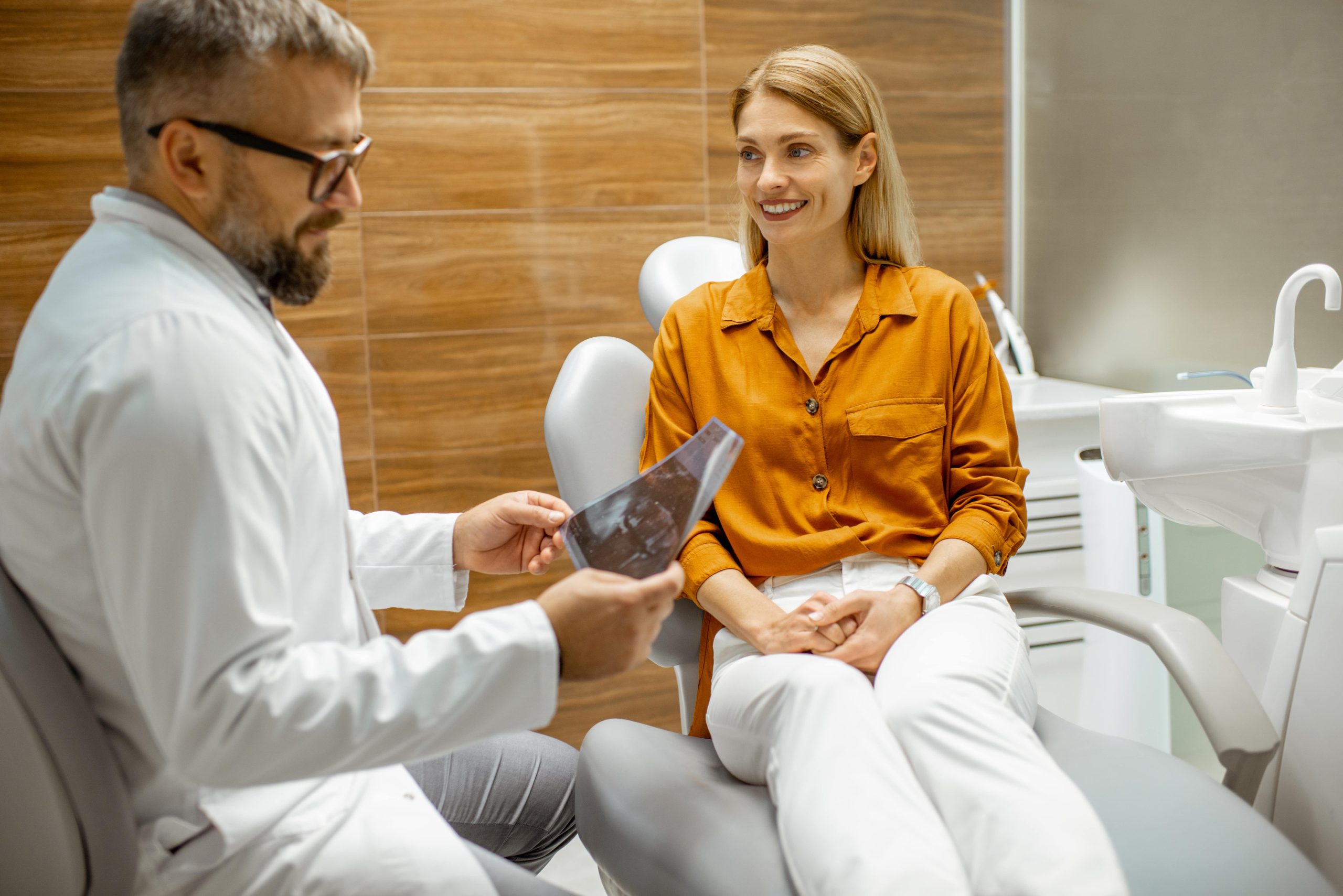 woman talking to a dentist at an orthodontic consultation