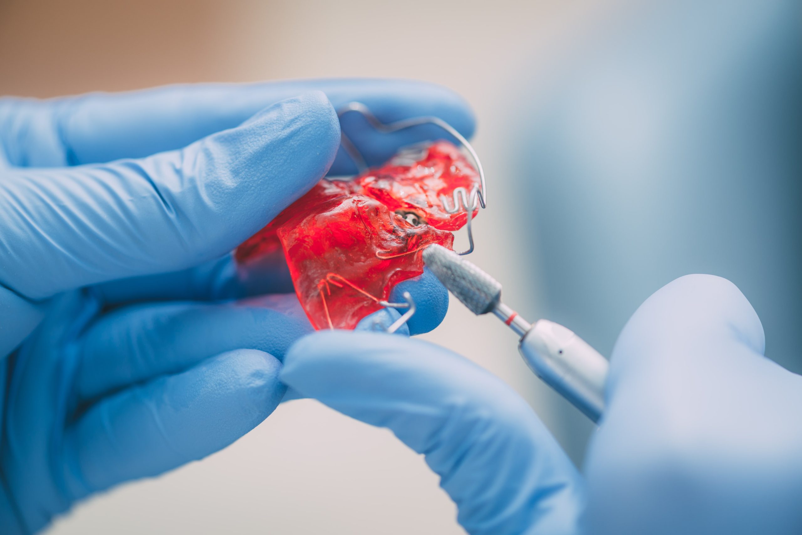 man working on orthodontic appliances